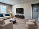 A bright living room with modern furniture and decor at 17170 E 90Th Pl, Commerce City, CO 80022