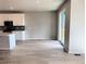 Open-concept living space connecting to the kitchen, and including sliding glass door at 17170 E 90Th Pl, Commerce City, CO 80022
