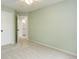Bedroom featuring light green walls, a ceiling fan, and a door leading to a bathroom at 15828 Greenstone Ln, Parker, CO 80134
