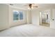 Spacious bedroom featuring a ceiling fan and large window for plenty of natural light at 15828 Greenstone Ln, Parker, CO 80134