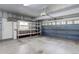 Functional garage with shelving for storage, an automatic door, and easy access to the outdoors at 15828 Greenstone Ln, Parker, CO 80134