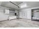 Spacious garage with storage shelving, a refrigerator, and ample room for vehicles at 15828 Greenstone Ln, Parker, CO 80134