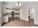 Open-concept kitchen with adjacent laundry area, stainless appliances, and ample counter space at 15828 Greenstone Ln, Parker, CO 80134