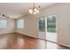 Living room boasts wood floors and a sliding glass door to the backyard at 15828 Greenstone Ln, Parker, CO 80134