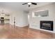 Open-concept layout with fireplace, laundry and view into updated kitchen at 15828 Greenstone Ln, Parker, CO 80134