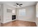 Bright living room area with ceiling fan and attractive floors, with a view to the updated kitchen at 15828 Greenstone Ln, Parker, CO 80134