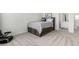 Neutral-toned bedroom with carpet, a platform bed frame, and an ensuite bathroom at 24326 E Ohio Dr, Aurora, CO 80018