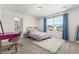 Bedroom with large windows, a plush rug, carpet and an ensuite bathroom at 24326 E Ohio Dr, Aurora, CO 80018