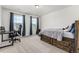 Cozy bedroom with two bright windows, carpet, and a unique platform bed frame with drawers at 24326 E Ohio Dr, Aurora, CO 80018