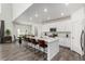 Bright, open-concept kitchen featuring a large island, stainless steel appliances, and ample cabinet space at 24326 E Ohio Dr, Aurora, CO 80018