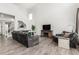 Bright living room with vaulted ceiling, wood floors, a fireplace, and comfortable seating at 24326 E Ohio Dr, Aurora, CO 80018