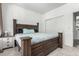 Comfortable main bedroom with a large bed, carpet, and view of the closet at 24326 E Ohio Dr, Aurora, CO 80018