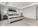 Spacious main bedroom features a decorative tray ceiling, carpet and large decorative bed frame at 24326 E Ohio Dr, Aurora, CO 80018