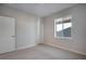 Neutral bedroom with plush carpet, trim and white doors at 9982 Wheeling St, Commerce City, CO 80022