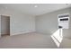 Bright, modern bedroom features neutral carpet, baseboards, and trim, plus large window at 9982 Wheeling St, Commerce City, CO 80022