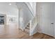 Bright entryway with hardwood floors, staircase, and doors provides a welcoming and functional space at 9982 Wheeling St, Commerce City, CO 80022
