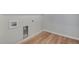 Empty laundry room with light wood-look flooring and white walls at 9982 Wheeling St, Commerce City, CO 80022