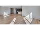 Bright living area featuring an open layout, hardwood floors, recessed lights, and contemporary design at 9982 Wheeling St, Commerce City, CO 80022