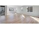 Spacious living room featuring hardwood floors, abundant natural light, and modern windows at 9982 Wheeling St, Commerce City, CO 80022