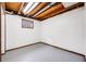 Finished basement with light gray flooring and walls, perfect for customization at 1549 S Evanston St, Aurora, CO 80012