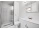 Bathroom featuring a glass shower and sink with white vanity and mirror at 1549 S Evanston St, Aurora, CO 80012