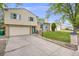 Charming home with a two-car garage, a basketball hoop, and blue shutters and a number on the mailbox at 1549 S Evanston St, Aurora, CO 80012