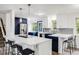 Spacious kitchen featuring stainless steel appliances, a large island with bar seating, and ample counter space at 1549 S Evanston St, Aurora, CO 80012