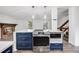 Modern kitchen featuring stainless steel appliances, an induction cooktop, and a marble island at 1549 S Evanston St, Aurora, CO 80012
