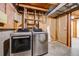 Convenient laundry area with modern washer and dryer, and exposed piping at 1549 S Evanston St, Aurora, CO 80012