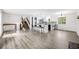 Spacious living room featuring stairs, bar seating with views into the updated kitchen at 1549 S Evanston St, Aurora, CO 80012