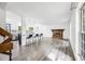 Bright and airy living room with fireplace, bar seating, and views into the modern kitchen at 1549 S Evanston St, Aurora, CO 80012
