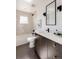 Modern bathroom with tiled shower-tub combination, contemporary vanity, and stylish mirror at 3435 W 17Th Ave, Denver, CO 80204