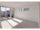 Bright bedroom featuring neutral carpet, sleek trim, and large windows offering ample natural light at 3435 W 17Th Ave, Denver, CO 80204