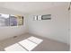 Bright bedroom featuring neutral carpet, sleek trim, and large windows offering ample natural light at 3435 W 17Th Ave, Denver, CO 80204