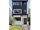 Contemporary home with a black and white exterior, showcasing clean lines, balconies, and inviting front entrance at 3435 W 17Th Ave, Denver, CO 80204
