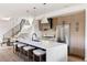 Bright kitchen featuring a waterfall island, stainless steel appliances, and modern pendant lighting at 3435 W 17Th Ave, Denver, CO 80204