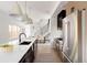 Stylish kitchen with a spacious island, modern appliances, and an adjacent dining area at 3435 W 17Th Ave, Denver, CO 80204