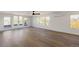 Spacious living room boasting hardwood floors, abundant natural light, and access to an outdoor balcony at 3435 W 17Th Ave, Denver, CO 80204