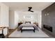 Bright main bedroom showcasing a contemporary fireplace, stylish furniture, and a calming color palette, ensuring relaxation at 3435 W 17Th Ave, Denver, CO 80204