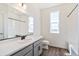 Well-lit bathroom with a vanity, toilet, and shower/tub combo, designed for comfort and functionality at 13575 E 110Th Ln, Commerce City, CO 80022