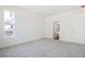 Comfortable bedroom with soft carpet, an ensuite bathroom, and a large window allowing natural light to fill the space at 13575 E 110Th Ln, Commerce City, CO 80022