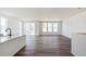 Open living space and modern island kitchen with stainless steel appliances at 13575 E 110Th Ln, Commerce City, CO 80022