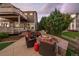 Backyard view featuring a patio with a grill and fire pit, perfect for entertaining at 11691 Riverdale Dr, Parker, CO 80138