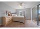 Comfortable bedroom features a ceiling fan, closet, and natural light at 11691 Riverdale Dr, Parker, CO 80138