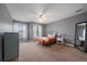 Spacious bedroom with ceiling fan, closet, neutral paint, and carpet at 11691 Riverdale Dr, Parker, CO 80138