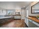 Large main bathroom features a soaking tub, double vanity, and stylish tile flooring at 11691 Riverdale Dr, Parker, CO 80138