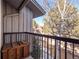 Balcony showcasing neighborhood views with trees and some snow on the ground at 2308 Hearth Dr # 36, Evergreen, CO 80439