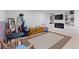 Finished basement with built-in shelving, a fireplace and entertainment area at 2308 Hearth Dr # 36, Evergreen, CO 80439