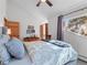 Bedroom with vaulted ceiling, window with backyard views, and a comfortable bed with stylish bedding at 2308 Hearth Dr # 36, Evergreen, CO 80439