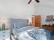 Bright bedroom with vaulted ceiling and a bed with soft bedding, complemented by a dresser and décor at 2308 Hearth Dr # 36, Evergreen, CO 80439